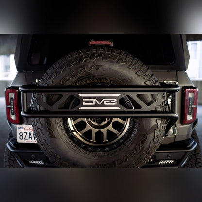 DV8 Offroad Spare Tire Guard & Accessory Mount | 2021 - 2025 Ford Bronco - Stateside Performance - Hitch Receivers - DV8 Offroad - DV8 Offroad Spare Tire Guard & Accessory Mount | 2021 - 2025 Ford Bronco