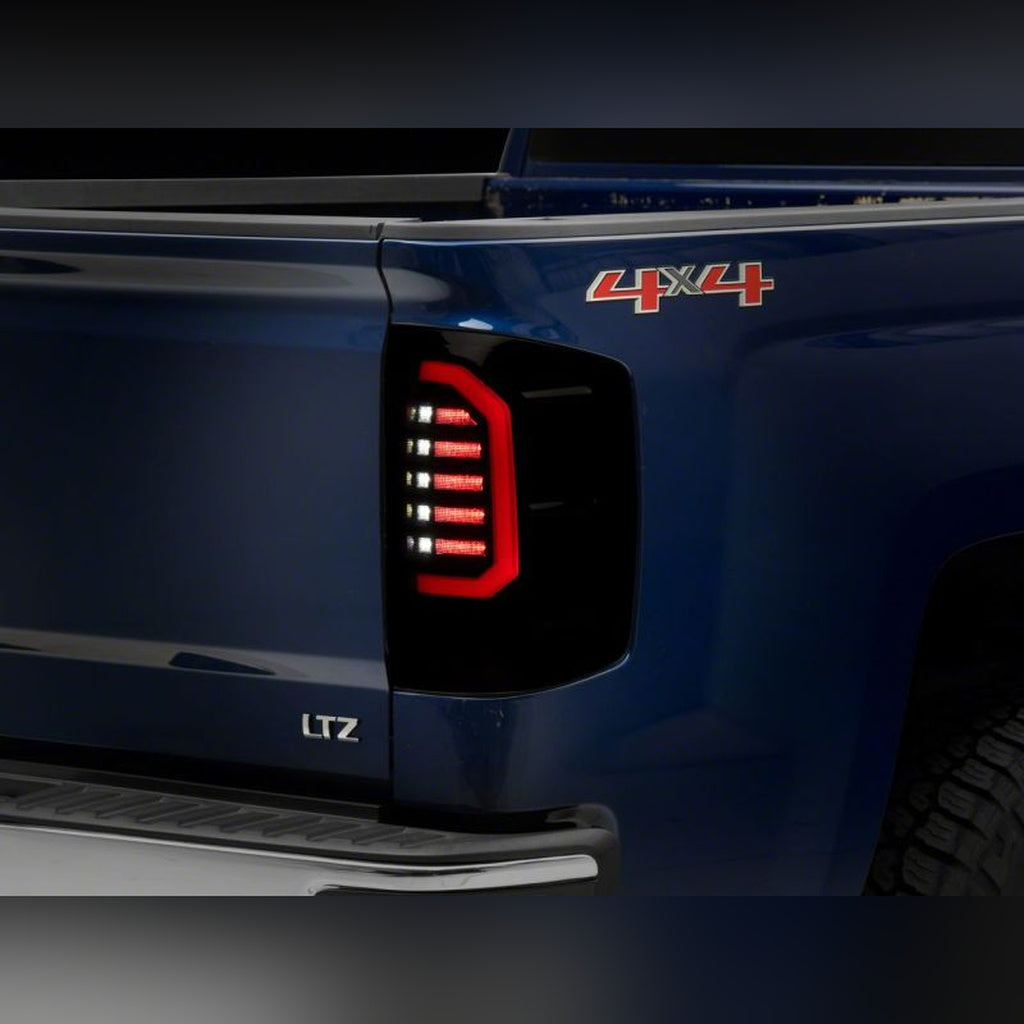 Raxiom Axial Series LED Tail Lights - Black Housing, Smoked Lens | 2015-2019 Chevy Silverado 2500HD
